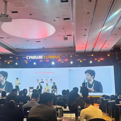 My work extends beyond the clinic to educating my peers. Here I am speaking at the Cynosure Lutronic APAC Summit, sharing my clinical experience and data on using advanced lasers for various conditions in Indian skin. Staying engaged with the global medical community ensures I bring the most current, evidence-based treatments back to my patients.