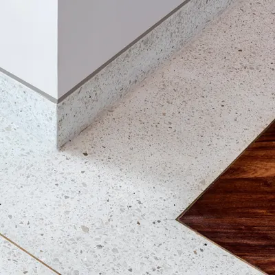 A detail of the flooring in the Terrazzo Residence. We love using cast-in-situ terrazzo with brass dividers, which creates a seamless, durable, and visually interesting surface that feels wonderful underfoot.
