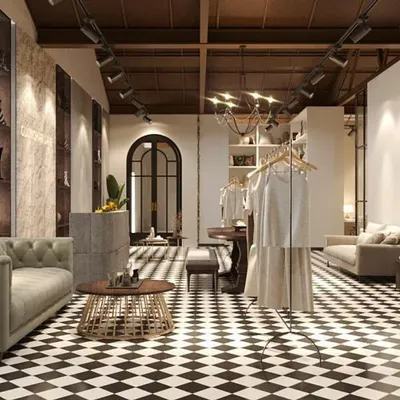 A rendering of the entrance area of the Gulmohar Lane store, featuring a classic black-and-white checkerboard floor. The space is set up like a grand foyer, immediately establishing a sense of home and elegance.