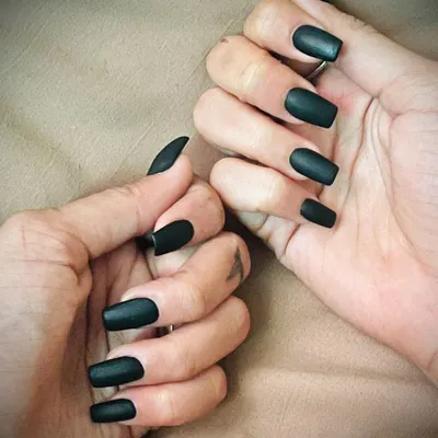 A full view of our popular matte black nails. This look is effortlessly cool and works beautifully on any nail shape, shown here on square and stiletto tips.
