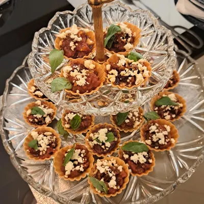 These Balsamic Tomato and Feta Tarts are perfect for high tea catering or as an elegant starter. They are presented on a tiered stand to make a beautiful addition to your party spread.