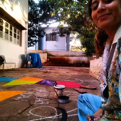 A quick selfie break after finishing a 45-foot floor mural in just a day and a half. Covered in paint but feeling accomplished, this is the reality of creating large scale interactive art that gets kids and adults moving.