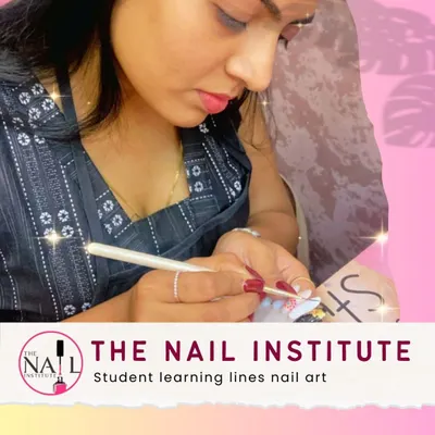 Straight, clean lines are harder than they look. This student is practicing her line work, a foundational skill for many nail art designs.