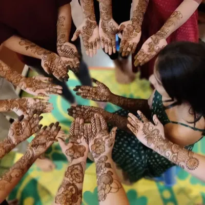 A fun group shot with a bridal party, all showing off their unique henna designs. I love being a part of these happy celebrations.