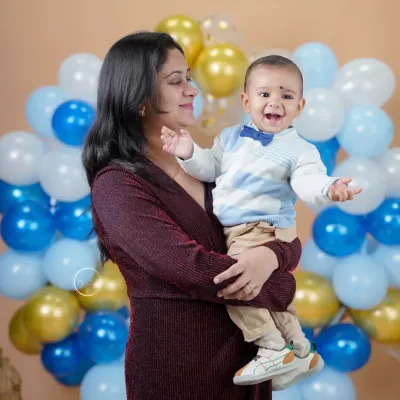A mother's love and a baby's laughter. This candid moment during a family portrait session is absolutely priceless.