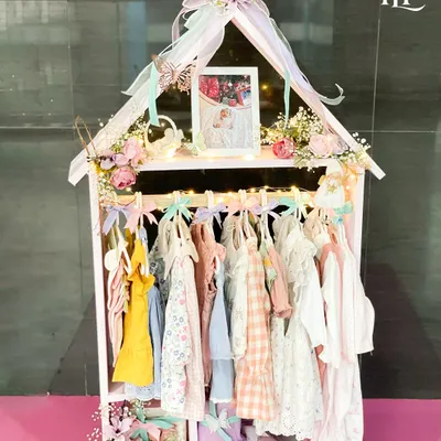 This 'Home of Love' hamper is one of my proudest creations, featuring a miniature wardrobe filled with adorable, handpicked outfits for a new baby girl. It’s more than a gift; it’s a keepsake wardrobe to celebrate her homecoming in style.