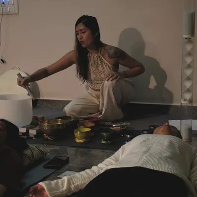 During an intimate Sturgeon Moon meditation, I use a crystal singing bowl to cleanse the energy of the space. Participants are resting in Savasana, fully immersed in the healing vibrations of the sound bath.