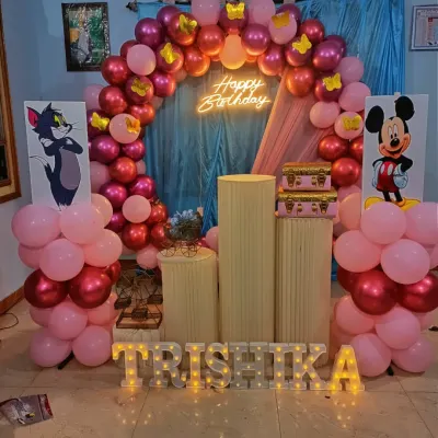 We bring cartoon themes to life for kids' parties, like this fun setup with Tom & Jerry and Mickey Mouse cutouts. The light-up name 'TRISHIKA' adds a special, personalized touch for the birthday girl.