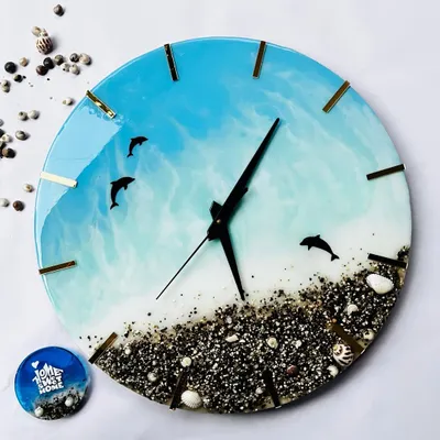 This 15 inch beach themed wall clock is one of my favorite home decor pieces to make. It features leaping dolphins, real sand and shells, and beautiful ocean waves created with resin. It can be fully customized and makes a wonderful gift.