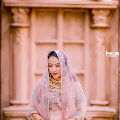 A beautiful, serene portrait of a bride-to-be in her traditional attire. The soft light and her gentle expression perfectly capture the anticipation and grace of this special time.