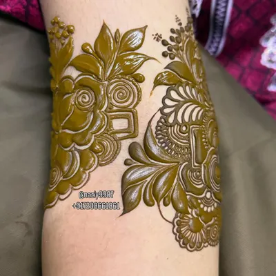 A beautiful floral arm band in progress. This design features a mix of roses and geometric shapes.