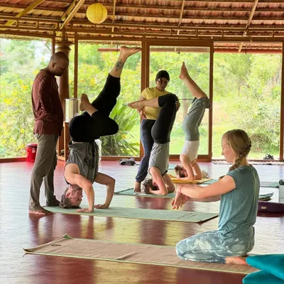 An asana workshop focusing on Sirshasana (Headstand). Our experienced teachers provide hands-on adjustments and guidance to help students safely explore challenging inversions.