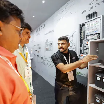 Here is one of our experts at the Smart Home Expo, explaining the intricacies of a SyncPro bedside panel and static voltage stabilizer. We love sharing our knowledge and helping clients understand the technology that powers their homes.