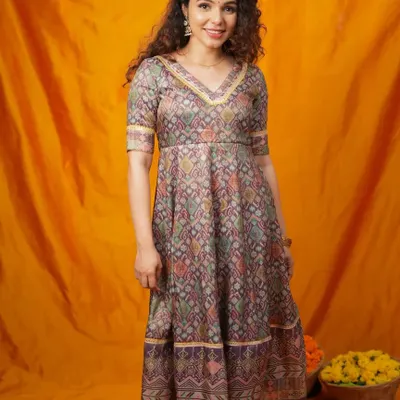 A beautiful Anarkali-style dress with a traditional Patola print. This tiered design has a lovely flare and can be adapted for a comfortable and flattering plus-size fit.