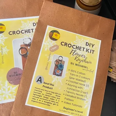 My DIY Crochet Kit for a flower keychain. It includes 100% cotton yarn, a crochet hook, a keychain, and both written and video instructions. It's a great project for beginners.
