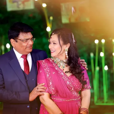 A candid, happy moment between the couple celebrating their 25th anniversary. The warm lighting and their natural smiles make this a perfect memory.