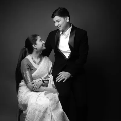 A timeless black and white portrait for a pre-wedding shoot. The word "SAATHIYA" (Companion) adds a touch of romance to this classic, elegant shot of the couple.