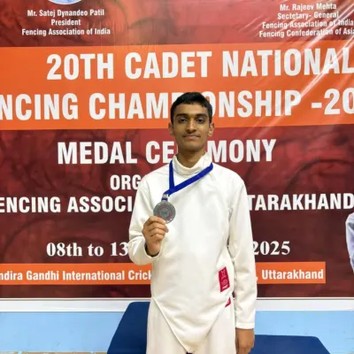 Sanket Ambhore stands proudly on the podium with his silver medal from the 20th Cadet National Fencing Championship. His performance in the Épée event is a testament to his skill and hard work.