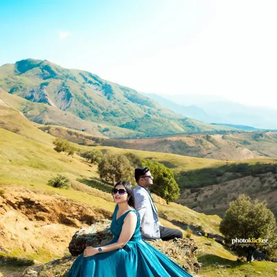 A majestic pre-wedding portrait set against the rolling hills of Mussoorie. We use grand landscapes to create epic, breathtaking images for our couples.