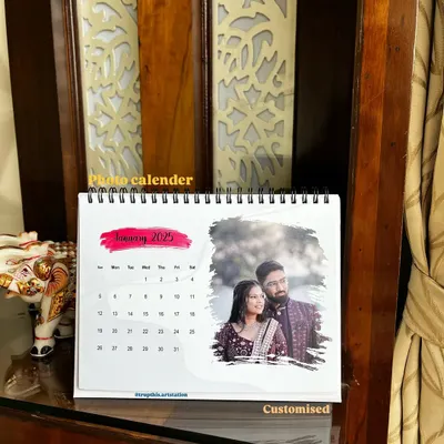 This is my spiral-bound custom desk calendar for 2025, featuring a beautiful couple's photo. Each month can be personalized with a different picture to celebrate your memories.