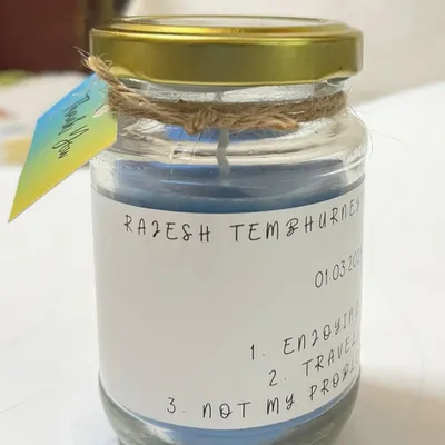 This custom jar candle was made for a client with a personal list printed on the label. You can choose the wax color, scent, and any text you want to make it your own.