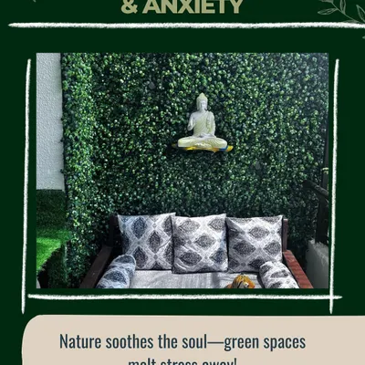 To create a space for stress relief, I combined a dense green wall with a serene, white Buddha statue. The comfortable bench with patterned cushions provides the perfect spot for quiet contemplation and helps melt away the day's anxieties.