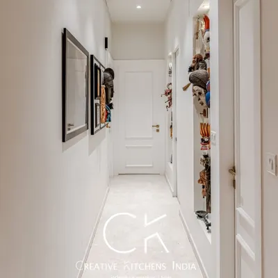 Hallways are the perfect canvas for personal expression. Here, we used thoughtful lighting and curated art pieces to transform a simple corridor into a striking visual gallery that sets the tone for the entire home.