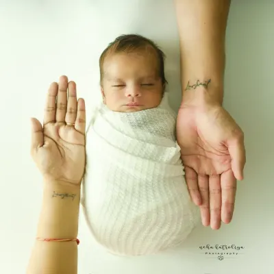 This iconic shot, with the parents' hands cradling their newborn, is a powerful symbol of family and protection. It's a simple, clean, and profoundly emotional portrait that I love creating.