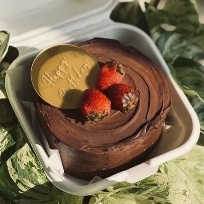 This is our take on a classic chocolate and strawberry cake. The rich, smooth chocolate frosting provides the perfect base for fresh, juicy strawberries and a personalized birthday message.