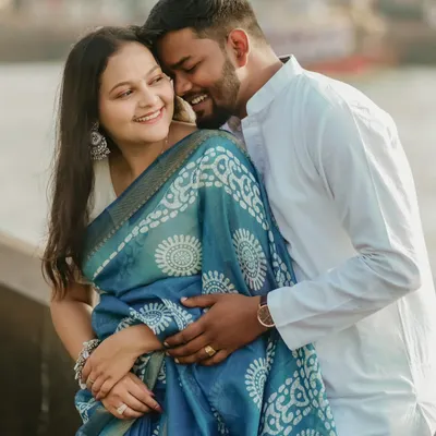 An old-school romance in the modern world. This intimate portrait of Abhishek and Saloni in traditional attire captures a moment of pure affection and joy.