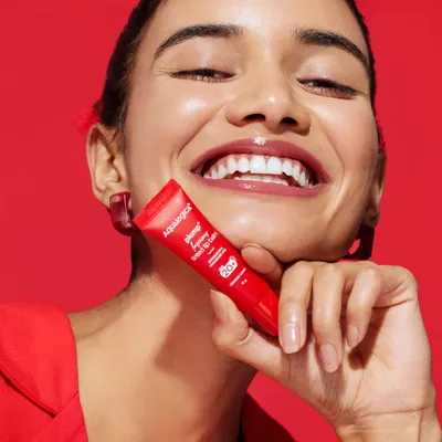 For this Aqualogica campaign, I used a bold, all-red theme. The model is styled in a simple red blazer, making the product and her radiant smile the focus.