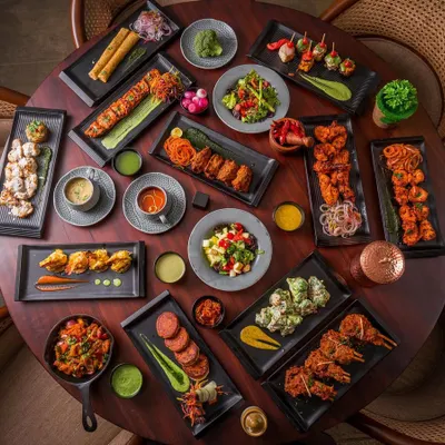 This image, a grand table filled with a variety of dishes we've shot, represents more than just food. It's a symbol of our journey, our growth, and the collaborative effort my team and I pour into every project to bring a brand's vision to life.