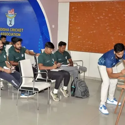 The whiteboard is where we connect theory to practice. During a seminar for Odisha Cricket Association coaches, I'm illustrating the biomechanics of a specific movement, ensuring every coach understands the underlying principles.