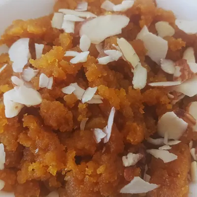 The rich, inviting aroma of Moong Dal Halwa, made without a drop of dairy. I use a homemade vegan ghee, prepared with the traditional bilona method, to achieve the same authentic taste and texture. This is a perfect example of how I veganize classic Indian desserts for festivals and special occasions.