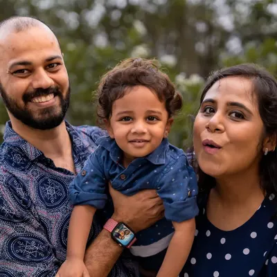 A family portrait is a beautiful way to freeze a moment in time. In this outdoor session, I captured the family looking toward the camera, creating a lovely, classic photo that highlights their happy smiles and togetherness.