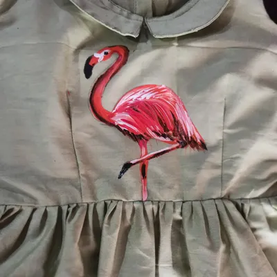 This vibrant flamingo was hand-painted on a dress during my fabric painting workshop. You can learn to customize your own clothes and textiles with permanent, colorful designs.