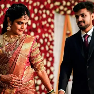 A candid moment from a wedding I worked on. You can see how the rich Kanjeevaram saree, heavy gold jewelry, and soft glam makeup come together for the final reception look.