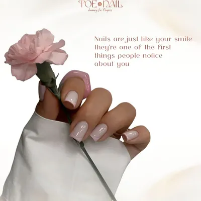 A beautiful example of a classic French manicure on perfectly shaped square nails. This timeless and elegant style is perfect for any occasion, offering a clean and polished look.