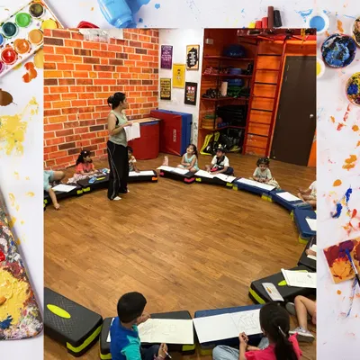 A wide shot of our art class in session. Students are seated in a circle, fostering a collaborative and interactive learning environment as they work on their drawings.