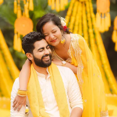 A quiet, candid moment during a Haldi ceremony. My approach to wedding photography is to capture these genuine interactions that tell the real story of your love.