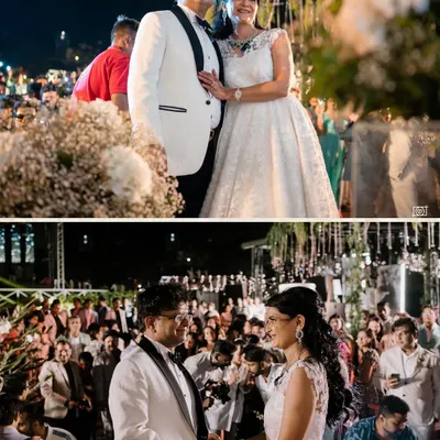 A beautiful portrait of the couple during their 25th-anniversary celebration in Goa. Dressed in elegant white, they are surrounded by family and friends, ready to celebrate their incredible journey together.