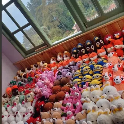 A mountain of finished amigurumi dolls, representing many hours of dedicated work. This is the scale I can handle for large wholesale crochet doll orders.