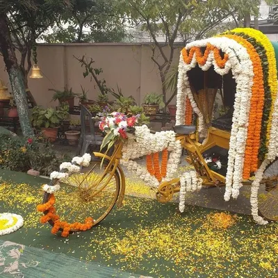A quirky and fun photo booth concept featuring a cycle rickshaw decorated with marigold and jasmine flowers. This was a huge hit among guests and added a touch of playful nostalgia to the event.