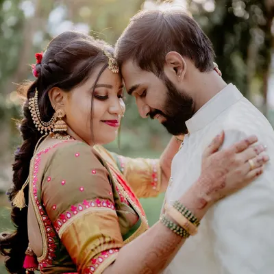 A quiet, intimate portrait that feels completely natural. I often guide couples into gentle poses like this to capture their connection without feeling staged, focusing on the soft light and their expressions.