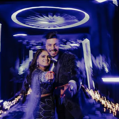 I love using creative techniques like motion blur to capture the whirlwind energy of a Sangeet night. This shot freezes the couple's happy faces while the background swirls with light and movement, perfectly depicting the festive atmosphere.