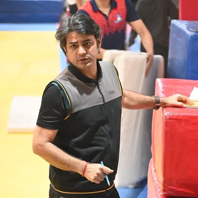 Head coach Praveen Sharma observing a training session. Every detail is monitored to ensure our gymnasts are developing correctly and safely.