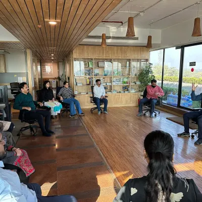 A corporate wellness session is more than just physical exercise, it is a dialogue. Here, I am leading a discussion on the sources of workplace stress and how yogic philosophy offers practical tools for managing them, fostering a more conscious and collaborative team environment.