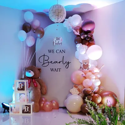 A classic "We Can Bearly Wait" baby shower theme. This cozy setup includes a giant teddy bear, custom backdrop, and a beautiful balloon arrangement in brown, pink, and white tones.