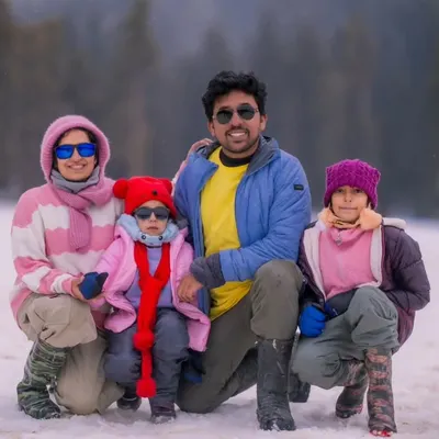 A portrait of my complete family in the snow. Capturing these moments of togetherness, even in the cold, is what family photography is all about.