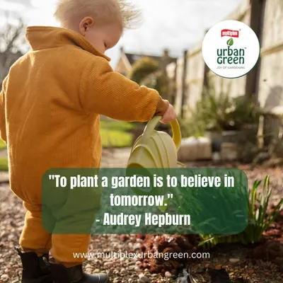 As Audrey Hepburn said, "To plant a garden is to believe in tomorrow." This image of a young child tending to a plant perfectly captures that spirit of hope and nurturing for the future.